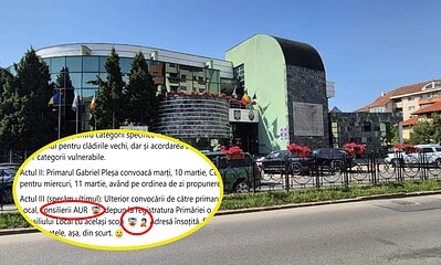 Clădirea Primăriei Alba Iulia cu steaguri și decoruri festive.