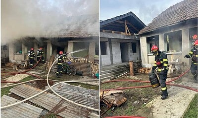 Echipaj de pompieri intervenind la stingerea unui incendiu la o locuință din Băgău.